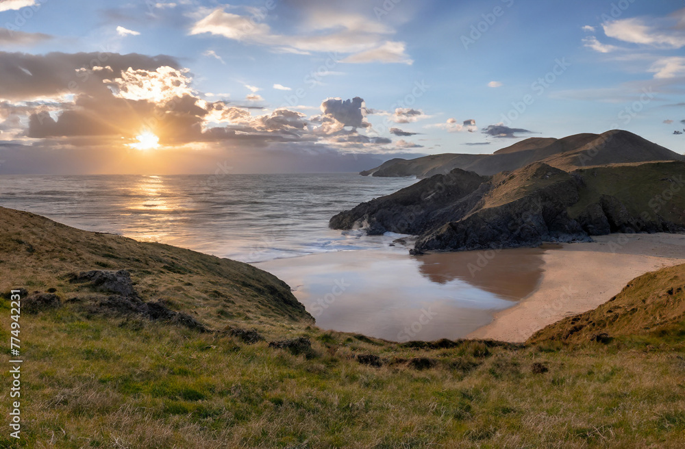 Scenic summer coastline view with mountains, beach, and blue ocean water