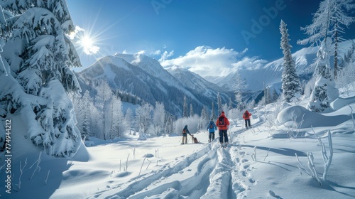 Family of parents and children walking home with a dog exploring the snowy winter landscape walking through the snowy landscape at winter sunset