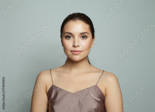Elegant model woman with natural make-up, healthy skin. Female beauty, cosmetology and skincare concept