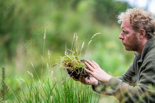 holding soil in hand. study soil health. soil fungi storing carbon through carbon sequestration on a farm, receiving carbon credits