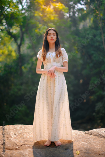 beautiful woman in white dress in deep forest  elf princess fairy tale concept