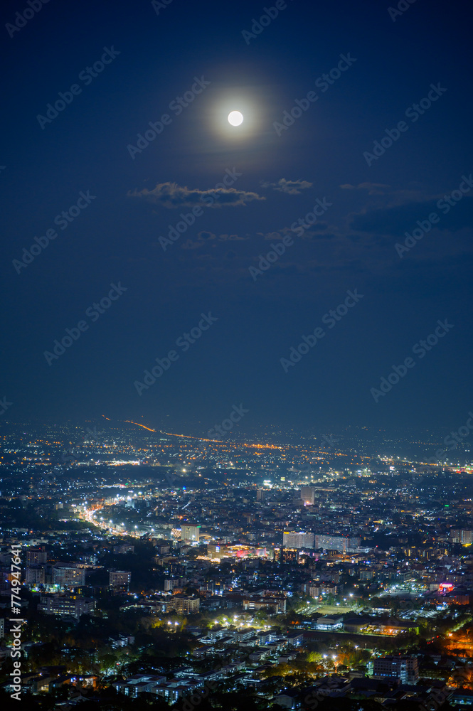 full moon over Chiang mai city at night, aerial view City night from the view point on top of mountain	