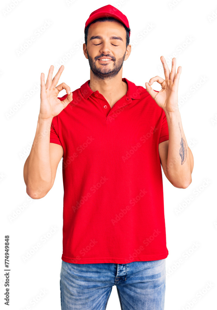 Naklejka premium Young handsome hispanic man wearing delivery courier uniform relax and smiling with eyes closed doing meditation gesture with fingers. yoga concept.