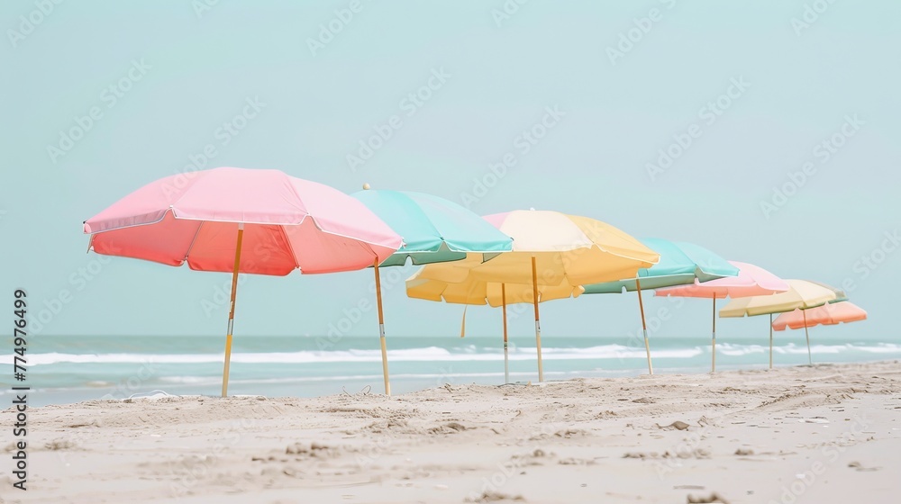 A row of pastel beach umbrellas on the sand  AI generated illustration