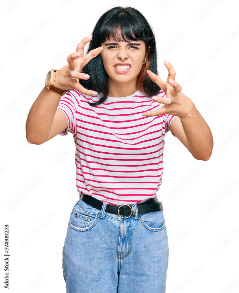 Young hispanic girl wearing casual clothes shouting frustrated with rage, hands trying to strangle, yelling mad Young hispanic girl wearing casual clothes shouting frustrated with rage, hands trying to strangle, yelling mad