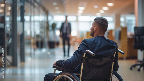 Confident man sitting in a wheelchair in a corporate business environment, inclusion