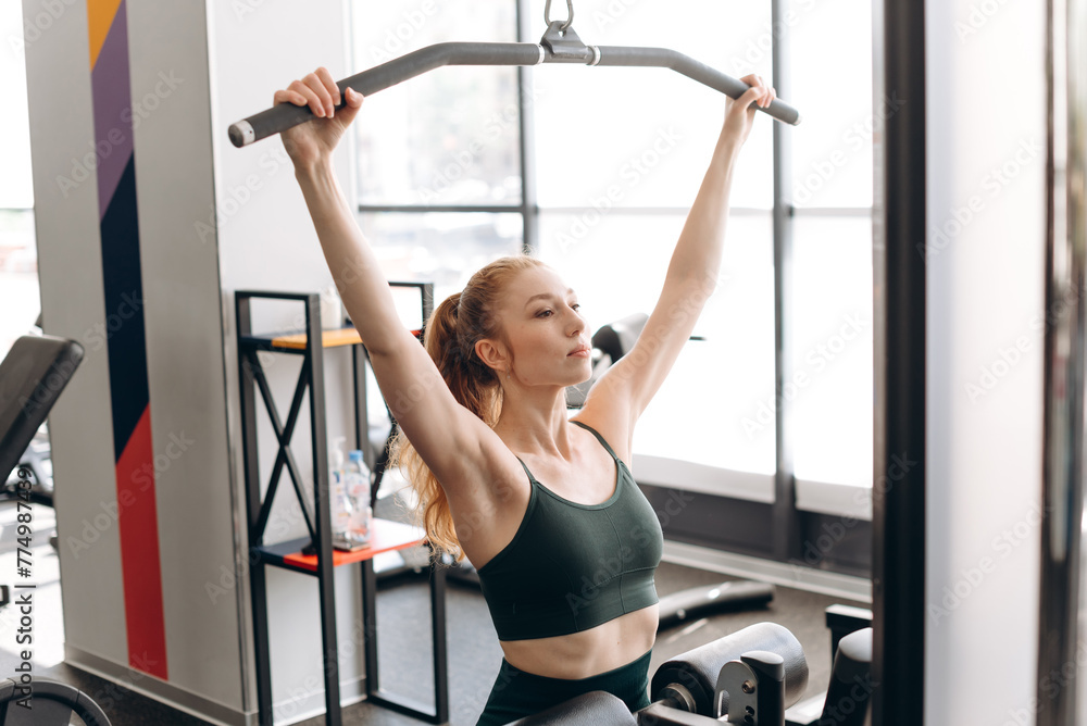 woman trains in fitness gym