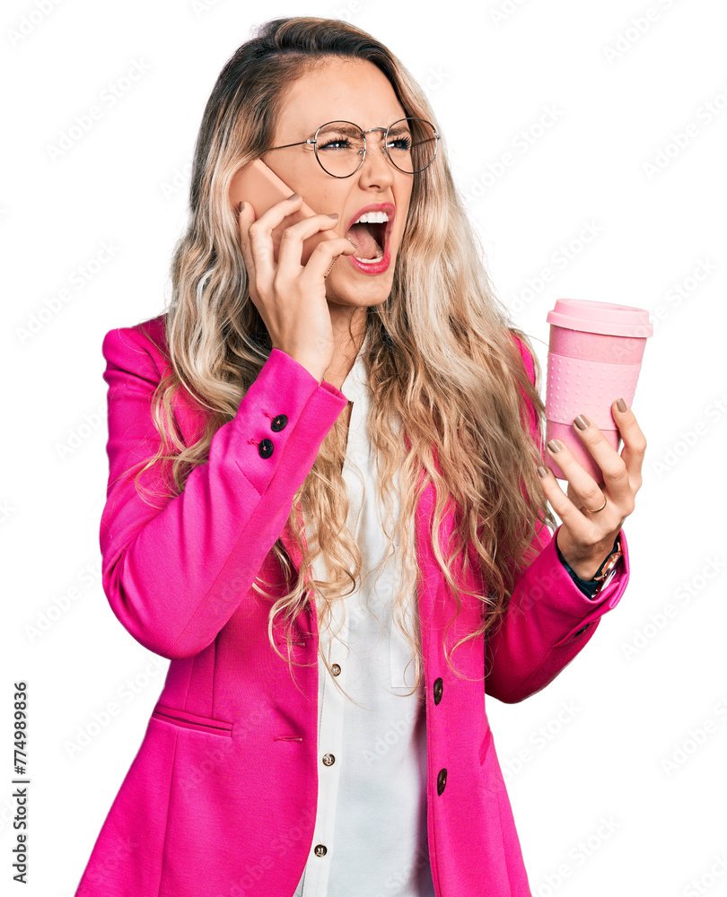 Φωτογραφία Young blonde woman wearing business style using smartphone and drinking a cup of coffee angry and mad screaming frustrated and furious, shouting with anger