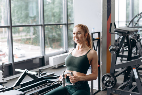 woman trains in fitness gym