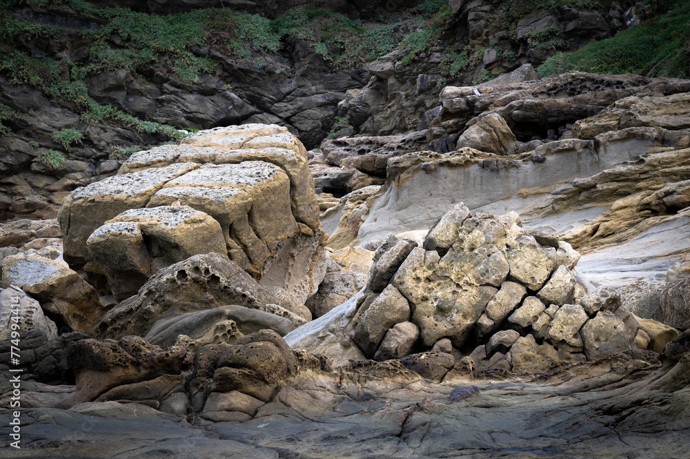 Amazing giant stones nearby the coastline, erosion by the sea and wind, become such a beautiful texture, shoot in long lens, in Keelung city, Taiwan. Amazing giant stones nearby the coastline, erosion by the sea and wind, become such a beautiful texture, shoot in long lens, in Keelung city, Taiwan.