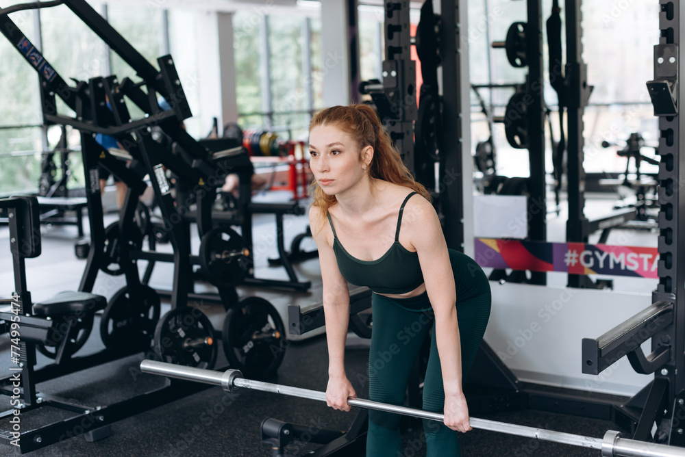 woman trains in fitness gym