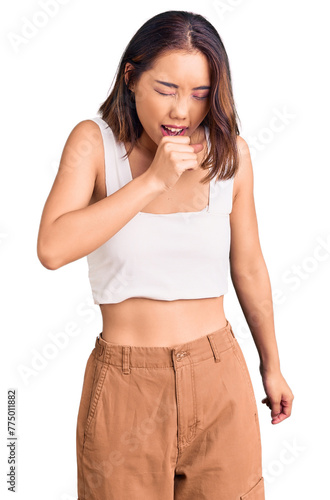 Young beautiful chinese girl wearing casual clothes feeling unwell and coughing as symptom for cold or bronchitis. health care concept. © Krakenimages.com