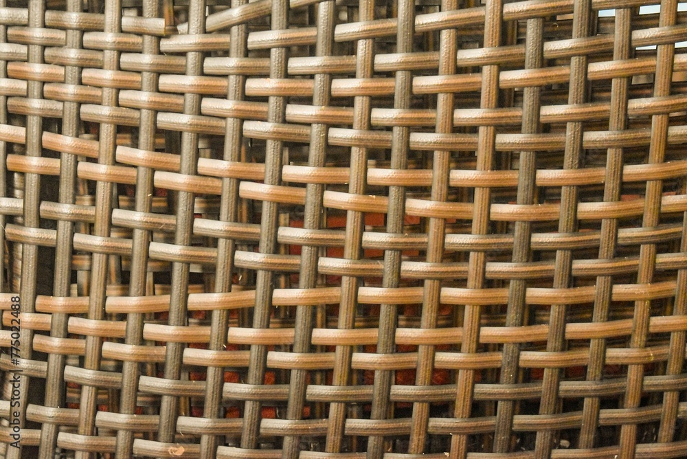 Closeup view of a of dry straw woven with giant rib with large holes Closeup view of a of dry straw woven with giant rib with large holes