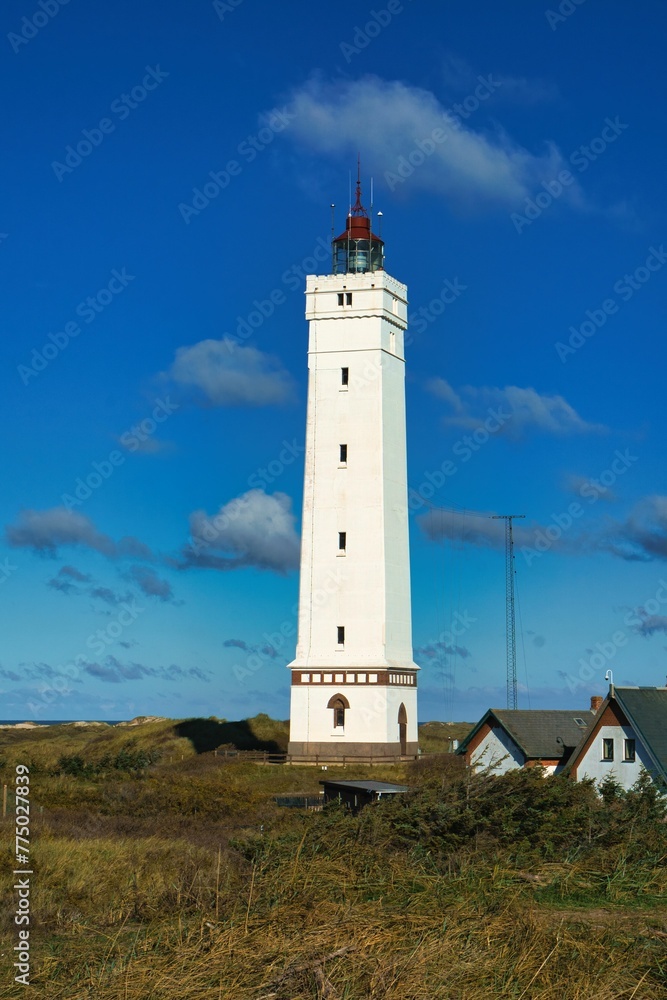 White Blavand Lighthouse against the blue sky in Denmark