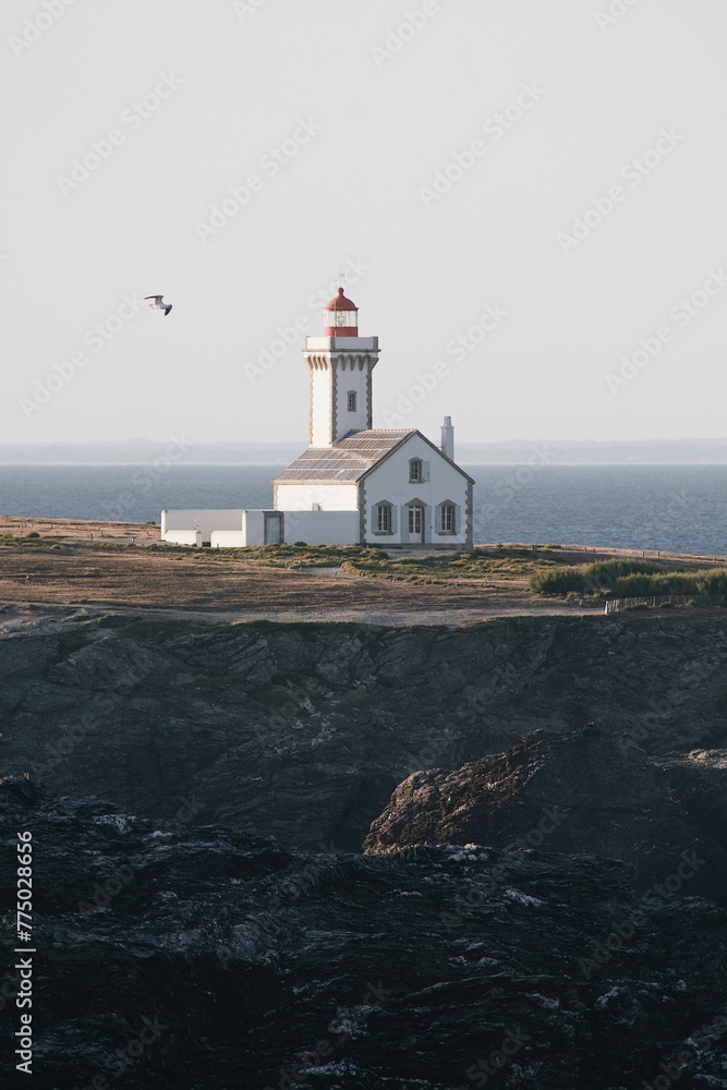 Poulains lighthouse on coast of the Atlantic Ocean at the northern tip of Belle Ile, Brittany France