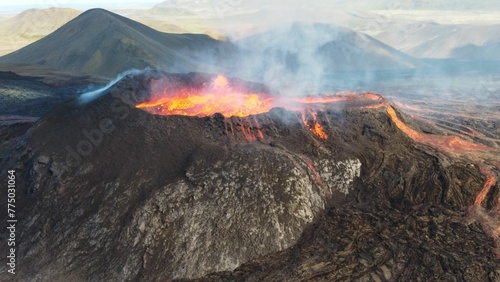 Photography Landscape of erupting Mauna Loa Volcano in Hawaii with smoke and blue horizon sk