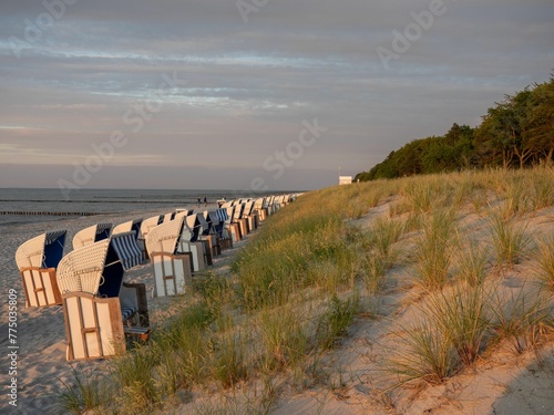 Strandkorbs, special hooded windbreak seating furniture captured along a beach photo