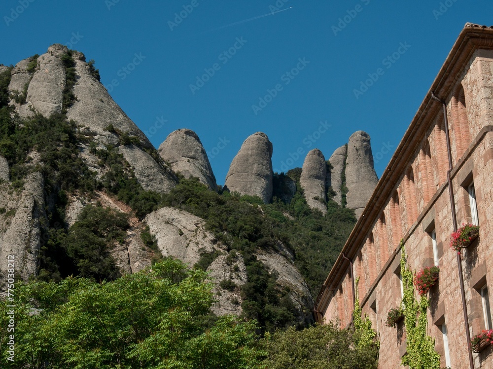 Abbey of Montserrat on the mountain of Montserrat in Catalonia, Spain with trees