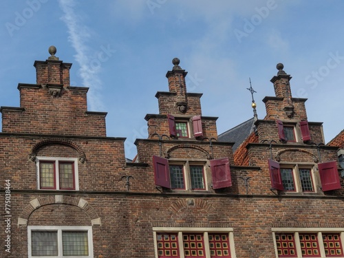 Old building's top against blue cloudy sky in the city of Nijmegen, Netherlands