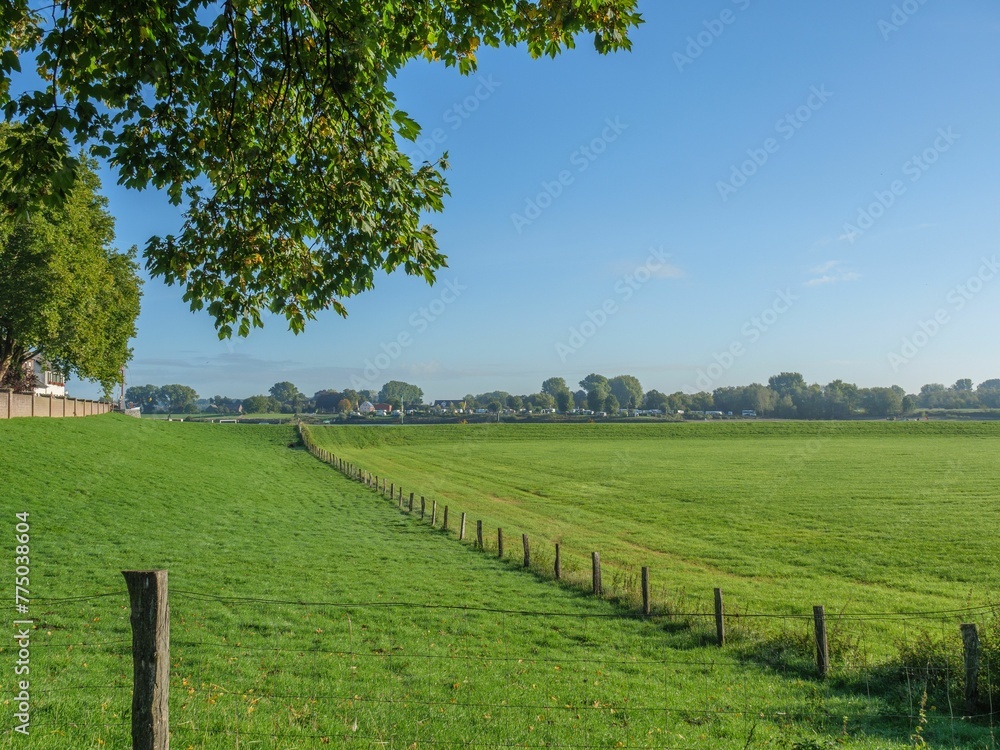 Beautiful view of the green field near the Rhine river in Lower Rhine region, Germany Beautiful view of the green field near the Rhine river in Lower Rhine region, Germany