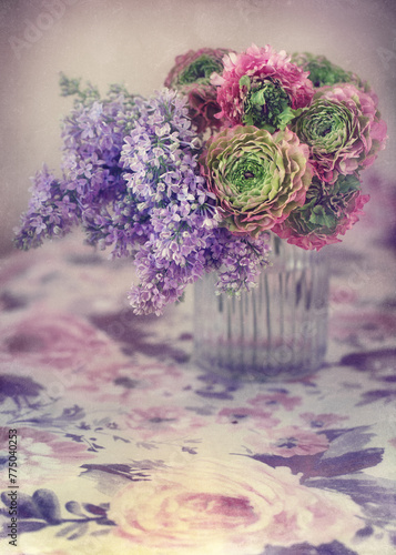 Beautiful bouquet of spring flowers in a vase on the table. Lovely bunch of flowers .
