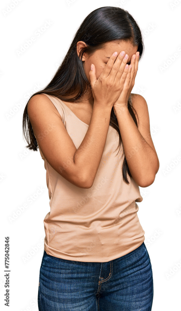 Beautiful hispanic woman wearing casual clothes with sad expression covering face with hands while crying. depression concept. Beautiful hispanic woman wearing casual clothes with sad expression covering face with hands while crying. depression concept.