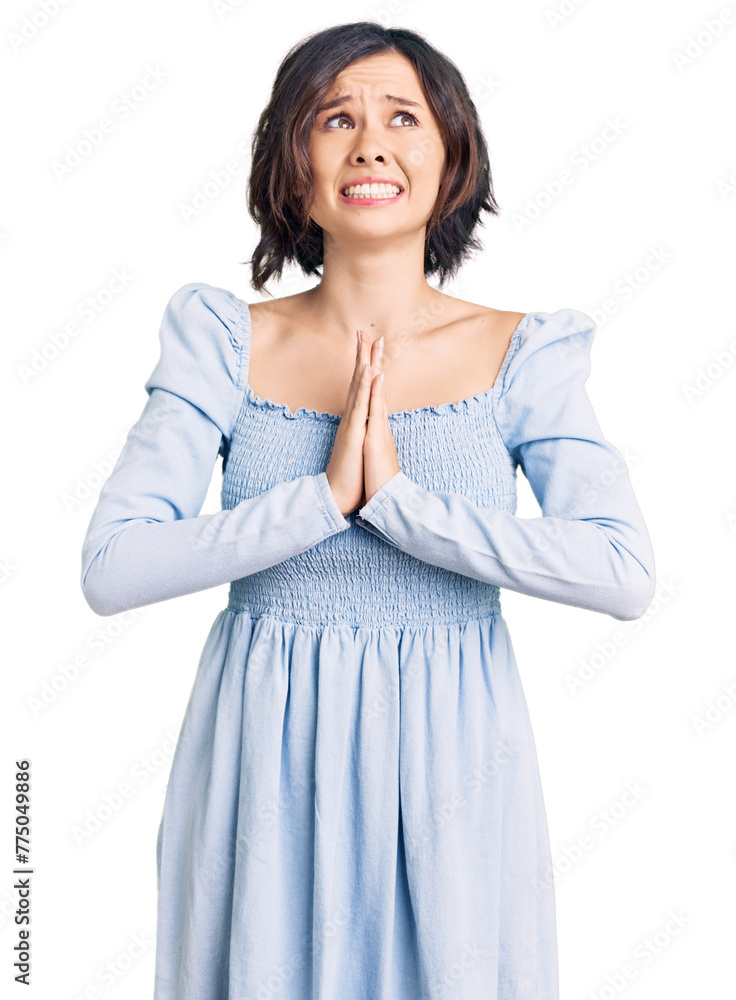 Young beautiful girl wearing casual clothes begging and praying with hands together with hope expression on face very emotional and worried. begging. Young beautiful girl wearing casual clothes begging and praying with hands together with hope expression on face very emotional and worried. begging.