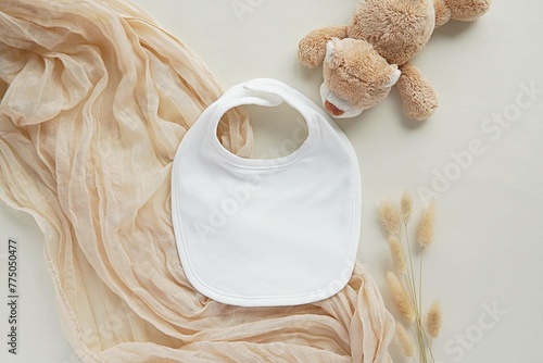 White cotton fabric baby bib mockup for design presentation, bohemian style flat lay, pregnancy announcement template.