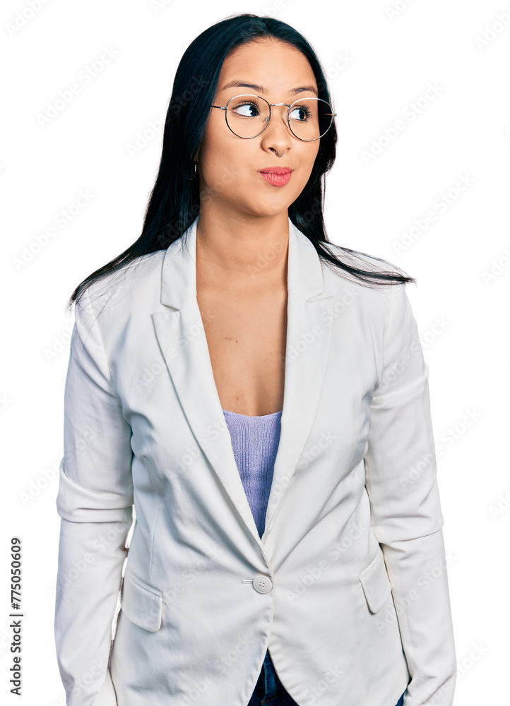 Beautiful hispanic woman with nose piercing wearing business jacket and glasses smiling looking to the side and staring away thinking. Beautiful hispanic woman with nose piercing wearing business jacket and glasses smiling looking to the side and staring away thinking.