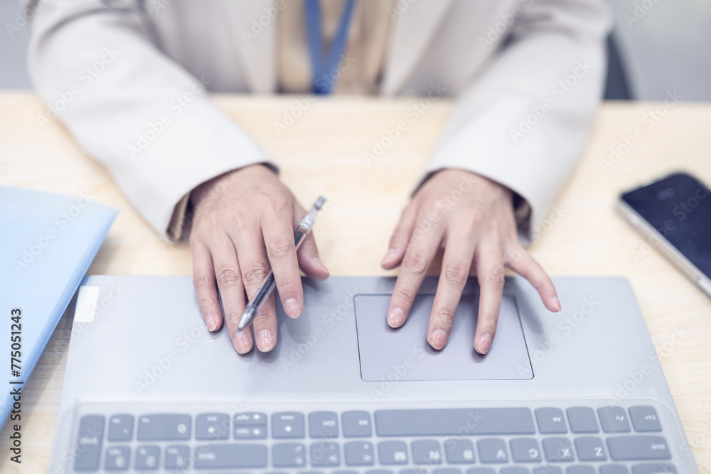 Woman hands working on laptop keyboard Woman hands working on laptop keyboard