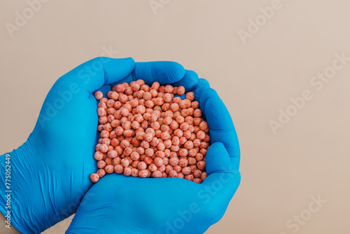 Close-up of a handful in the hands in the form of a heart etched soybean seeds