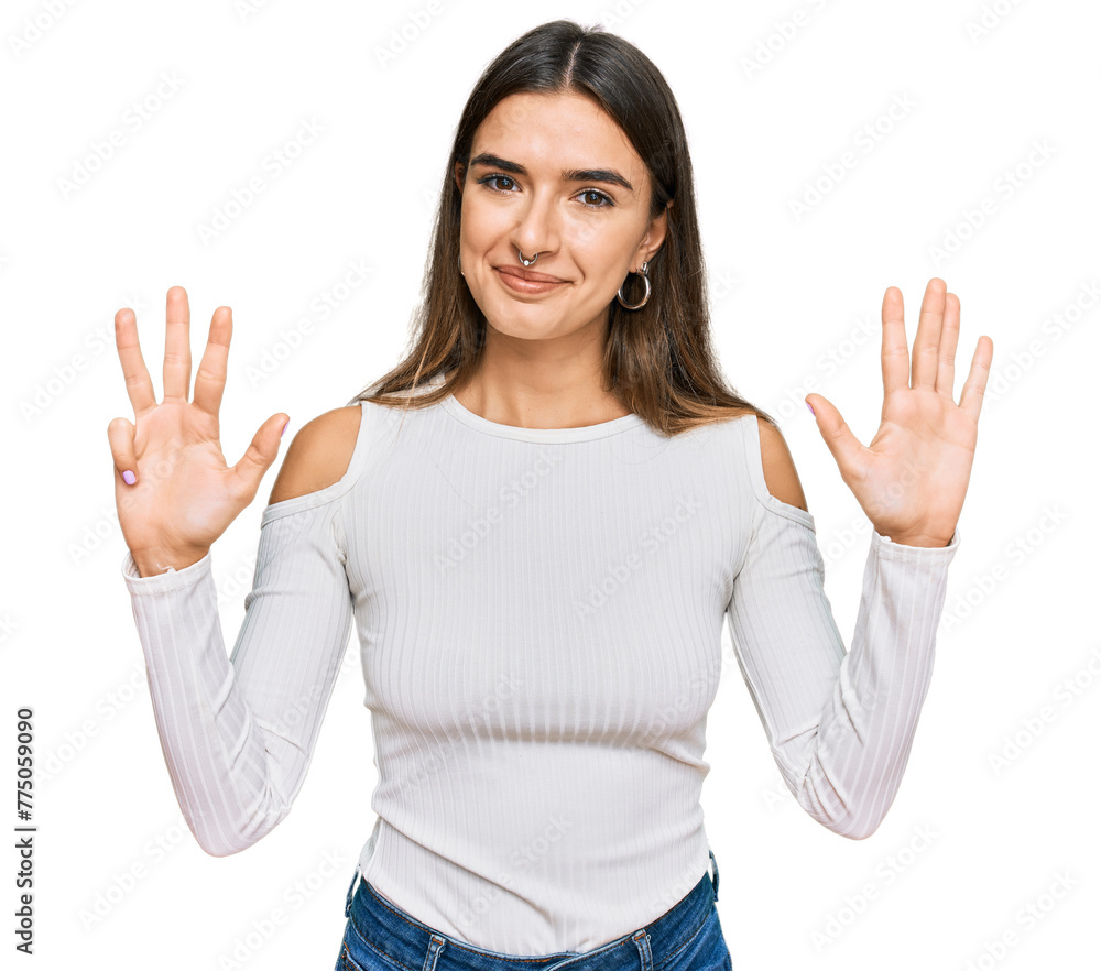 Young hispanic woman wearing casual clothes showing and pointing up with fingers number nine while smiling confident and happy. Young hispanic woman wearing casual clothes showing and pointing up with fingers number nine while smiling confident and happy.