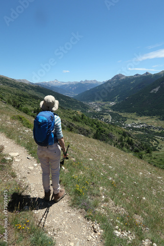 Hiker on a path in the Ecrins National Park. photo