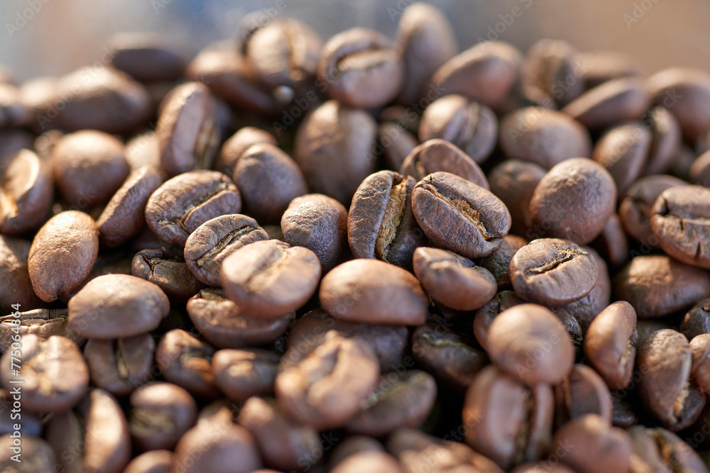 A close-up image capturing the rich, dark tones of carefully roasted Arabica coffee beans. Each bean glistens, highlighting the meticulous roasting process that enhances flavor and aroma A close-up image capturing the rich, dark tones of carefully roasted Arabica coffee beans. Each bean glistens, highlighting the meticulous roasting process that enhances flavor and aroma