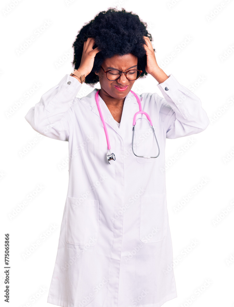 Young african american woman wearing doctor coat and stethoscope suffering from headache desperate and stressed because pain and migraine. hands on head. Young african american woman wearing doctor coat and stethoscope suffering from headache desperate and stressed because pain and migraine. hands on head.