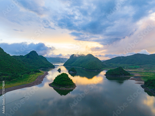 Summer lake in Oriental Guilin, Hainan, China, is burning with clouds