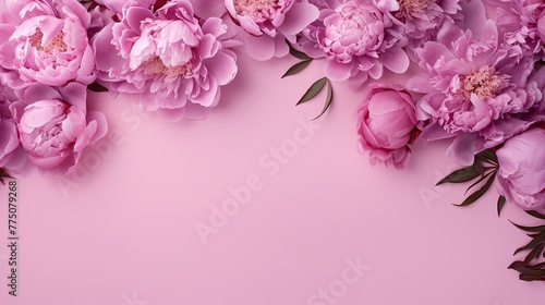 Festive bouquet of delicate peonies in pastel colors. Background for a holiday card or invitation. Blooming spring banner - lilac peonies, top view
