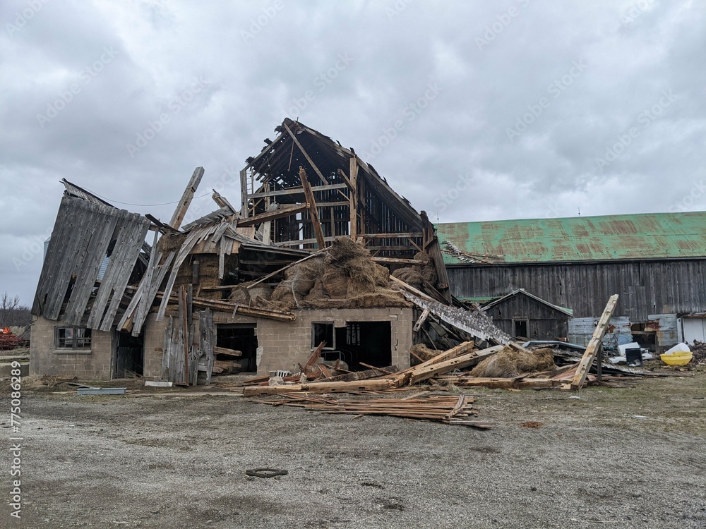 A falling barn with a hole in the roof A falling barn with a hole in the roof