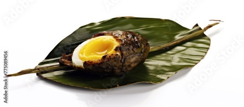 Khai pam is grill egg in banana leave. You can find in street food photo