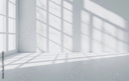 Minimal abstract grey and white backdrop for presentation your product. Background with play of light and shadows from windows on plaster wall in the empty cozy room.