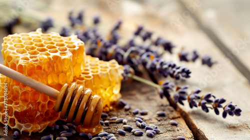 Honey in honeycombs and flowers on a wooden table - a beautiful still life.