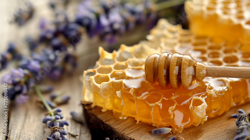 Honey in honeycombs and flowers on a wooden table - a beautiful still life. 