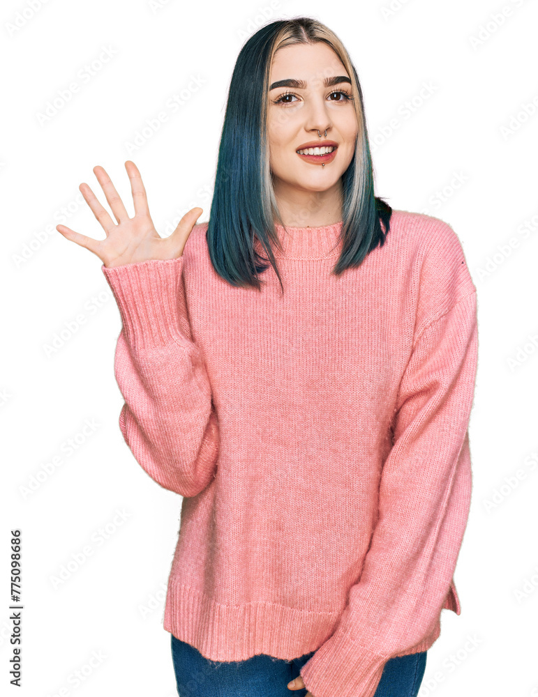 Young modern girl wearing pink wool winter sweater showing and pointing up with fingers number five while smiling confident and happy. Young modern girl wearing pink wool winter sweater showing and pointing up with fingers number five while smiling confident and happy.