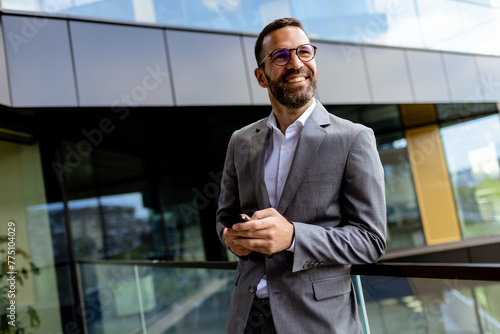 Confident Businessman Smili...