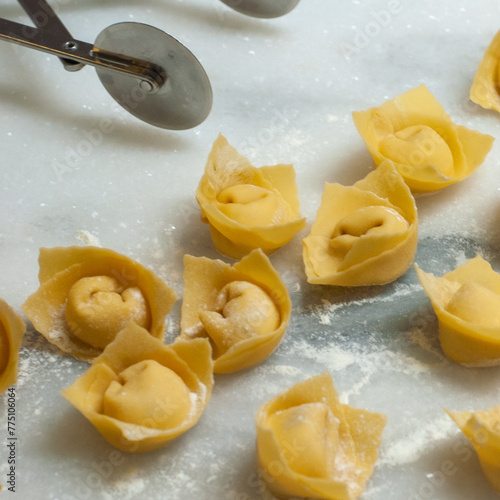 Italian Agnoltti, stuffed dough, dumplings on a plate (ID: 775106064)