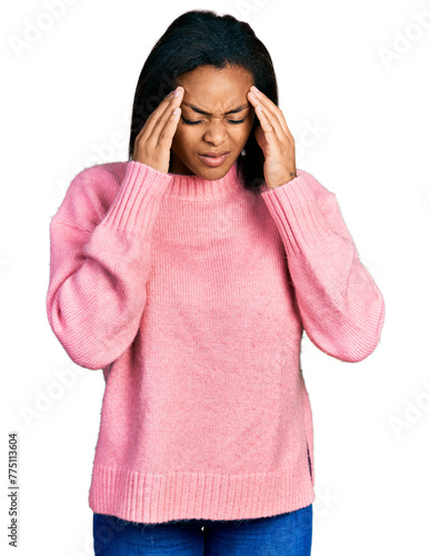 Beautiful hispanic woman wearing casual winter sweater with hand on head, headache because stress. suffering migraine.