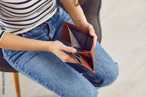 Valokuva Woman opening empty wallet, poor person having no money in purse, bankrupt with financial problems