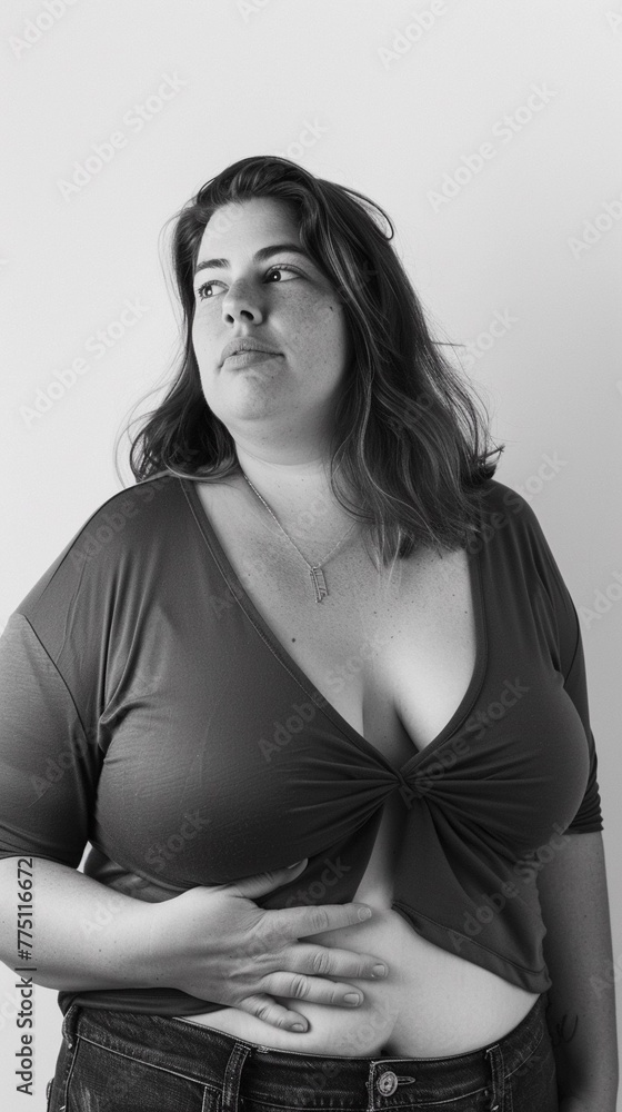 beautiful female model plus size on a simple isolated background beautiful female model plus size on a simple isolated background