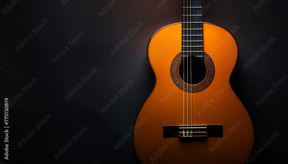 Guitar against the background of a dark wall	