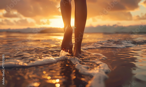 woman's feet walking on the beach at sunset